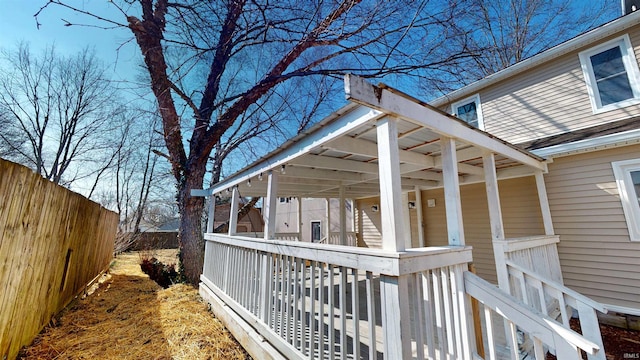 view of home's exterior with fence