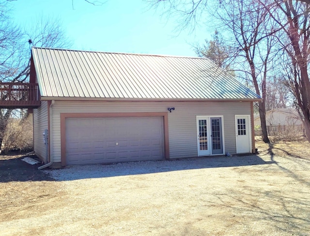 detached garage featuring french doors