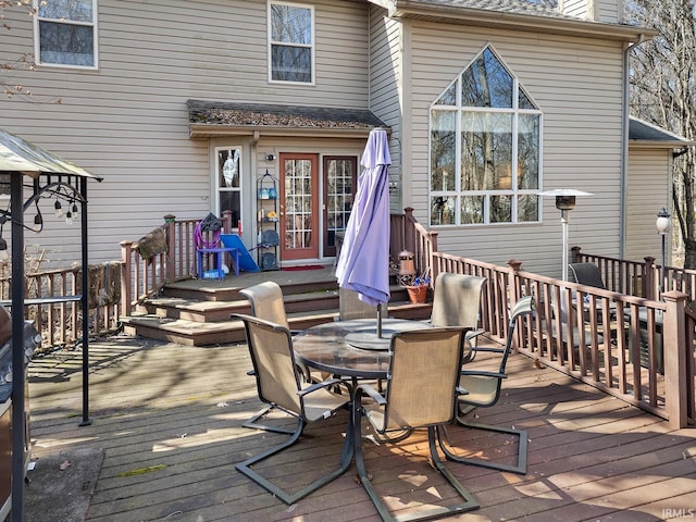 wooden deck with outdoor dining area