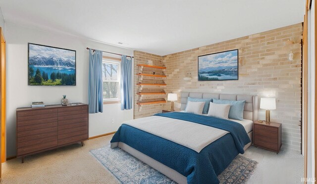 bedroom with baseboards and light colored carpet