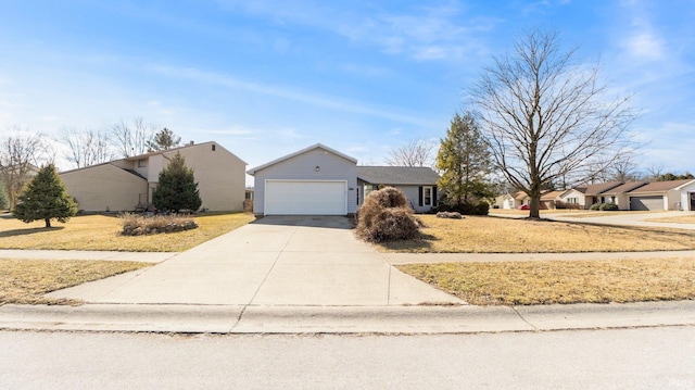 view of front of property with driveway and a garage