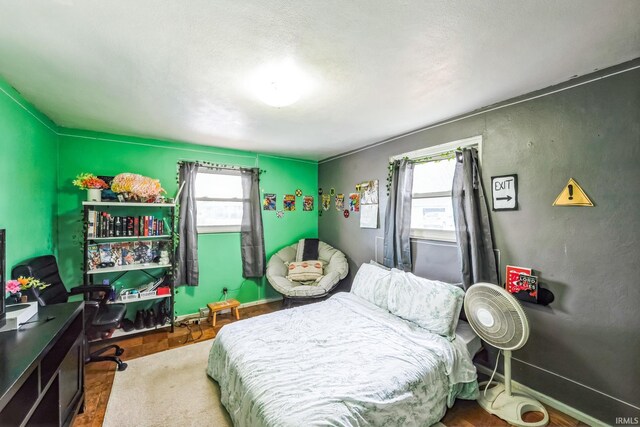 bedroom featuring baseboards