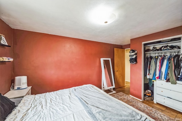 bedroom featuring a closet and wood finished floors