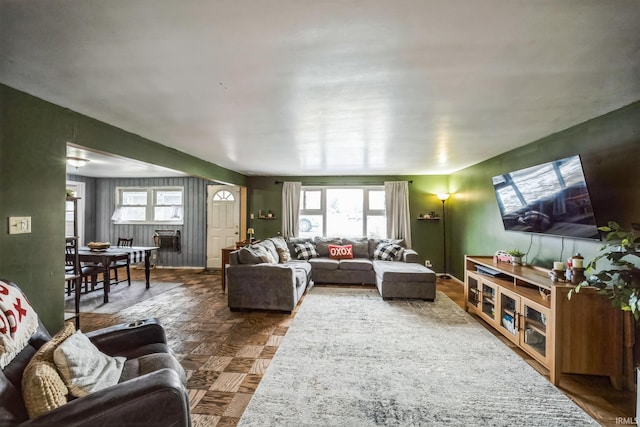 living area featuring baseboards