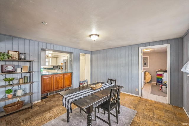 dining space featuring baseboards