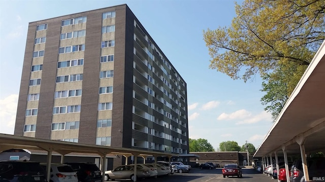 view of building exterior featuring covered parking