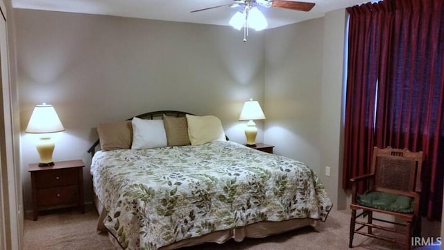 carpeted bedroom featuring a ceiling fan