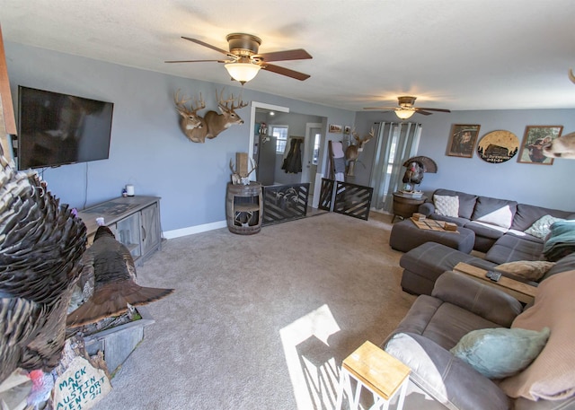 carpeted living room featuring baseboards