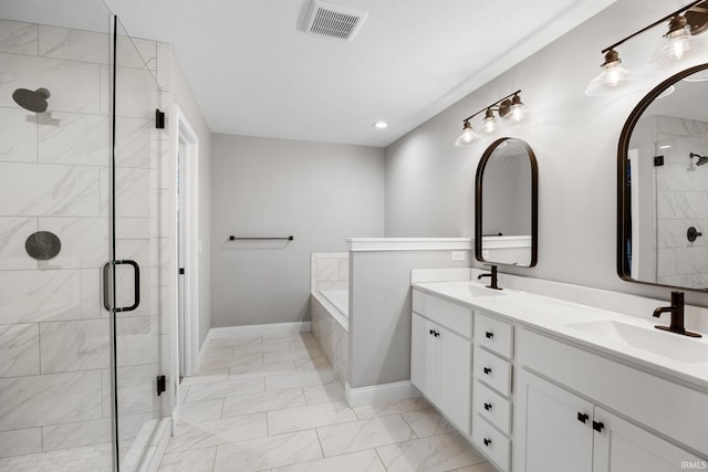 full bathroom featuring marble finish floor, a shower stall, visible vents, and a sink