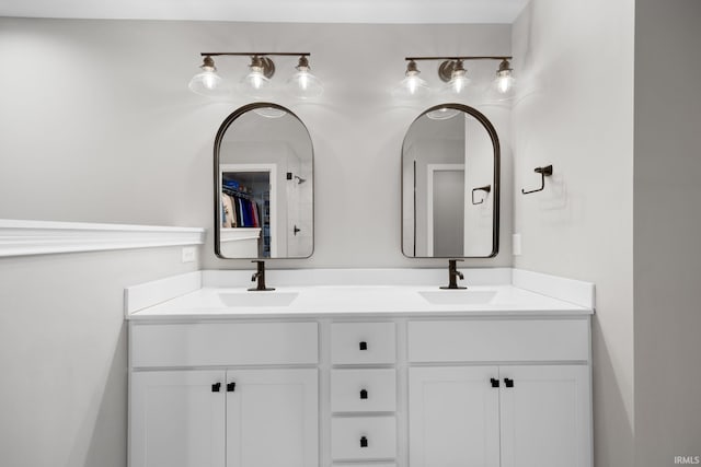 full bathroom featuring double vanity and a sink