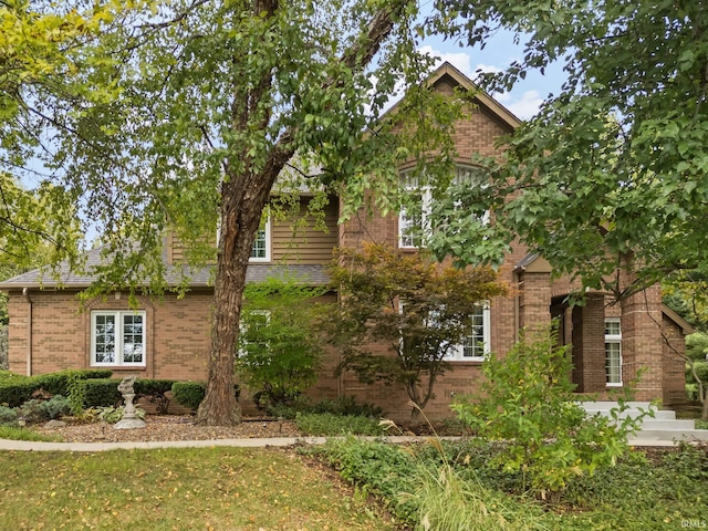 view of front of home featuring brick siding