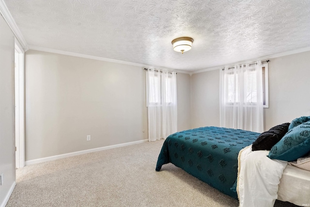 carpeted bedroom with baseboards, multiple windows, a textured ceiling, and crown molding