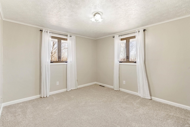 empty room featuring light carpet, visible vents, and a healthy amount of sunlight