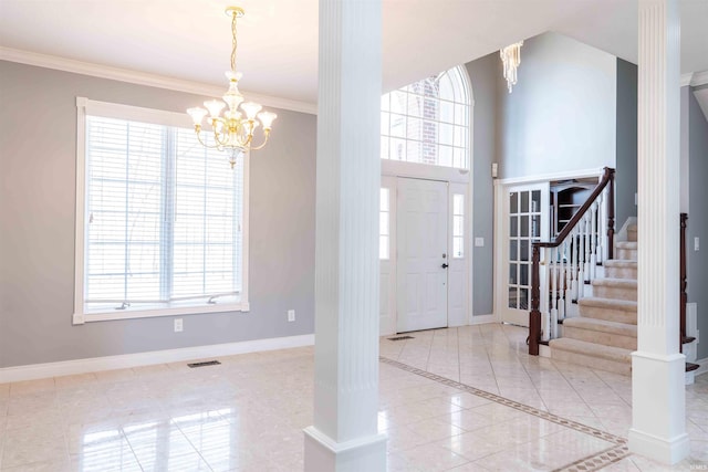 foyer with plenty of natural light and baseboards