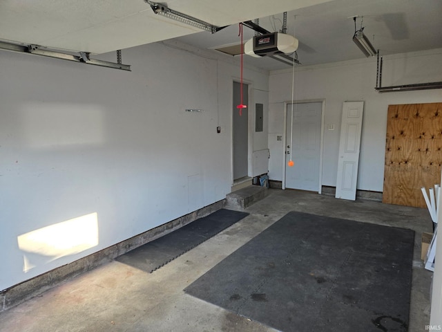 garage featuring electric panel and a garage door opener