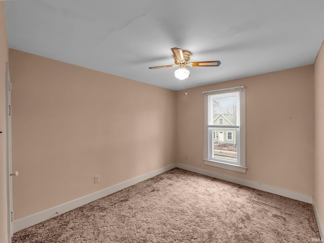 empty room with baseboards, carpet, and ceiling fan