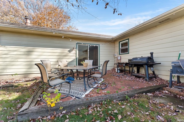 view of patio / terrace with a grill and outdoor dining space