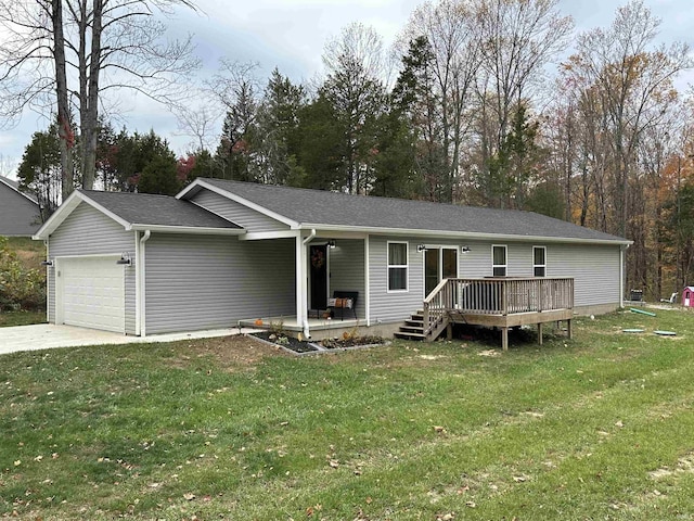 single story home with concrete driveway, a front yard, and a garage