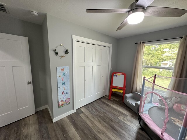 recreation room featuring visible vents, ceiling fan, baseboards, and wood finished floors