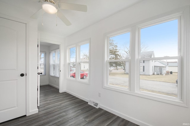 unfurnished sunroom with visible vents