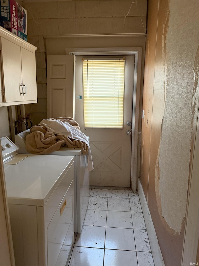 laundry room with cabinet space and separate washer and dryer