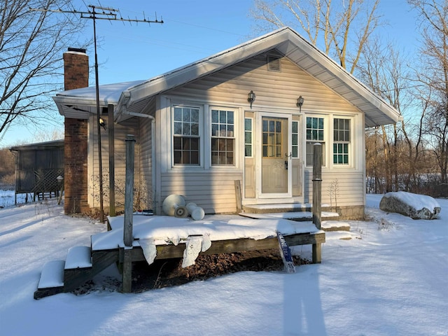 exterior space featuring a chimney