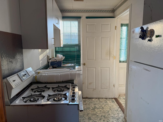 kitchen with freestanding refrigerator