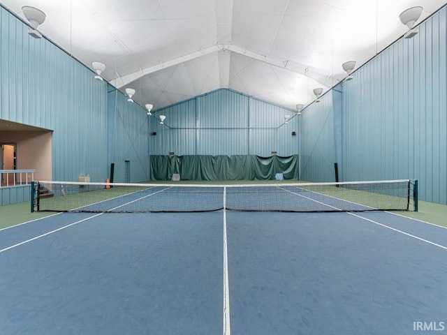 view of tennis court featuring fence