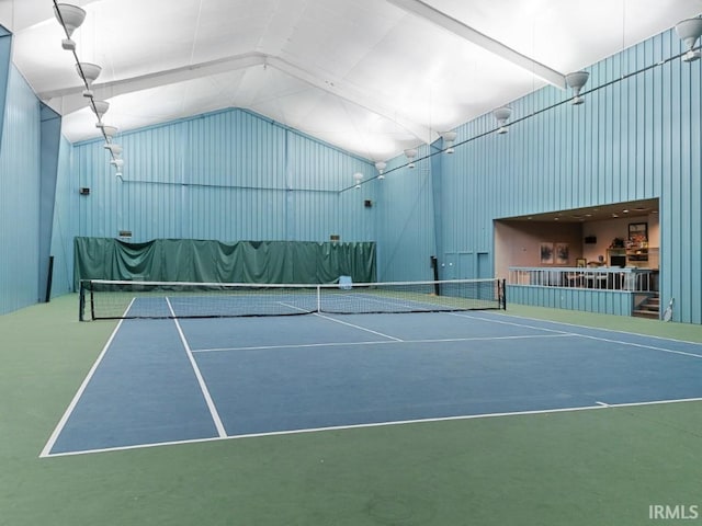 view of tennis court with fence