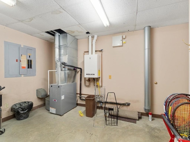 utility room featuring electric panel and water heater