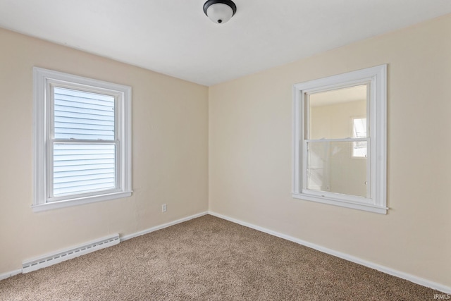 unfurnished room featuring baseboards, baseboard heating, and carpet floors