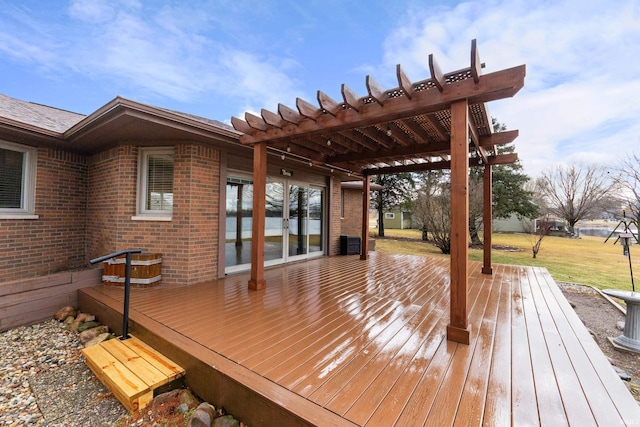 wooden terrace with a yard and a pergola