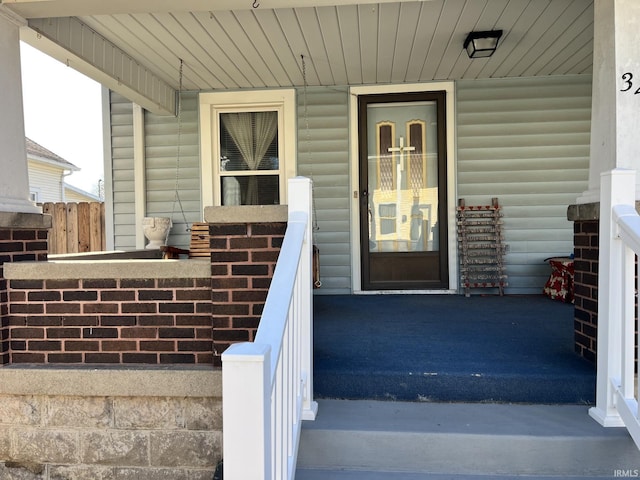 entrance to property with a porch