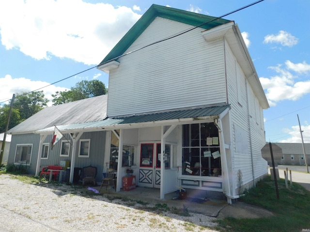 exterior space featuring metal roof