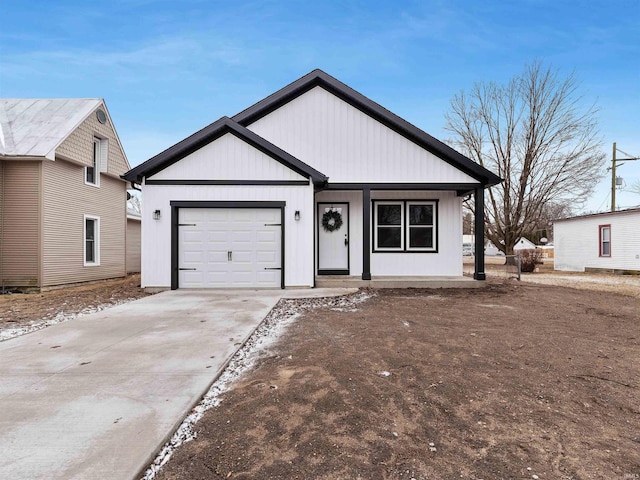 modern farmhouse style home featuring driveway and an attached garage