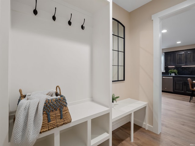 mudroom featuring recessed lighting, baseboards, and light wood-style floors