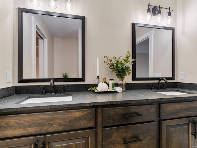 bathroom with a sink and double vanity