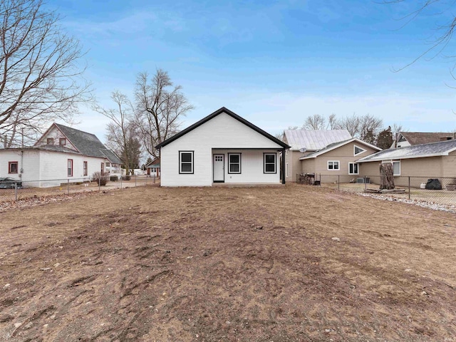 back of house featuring a fenced backyard