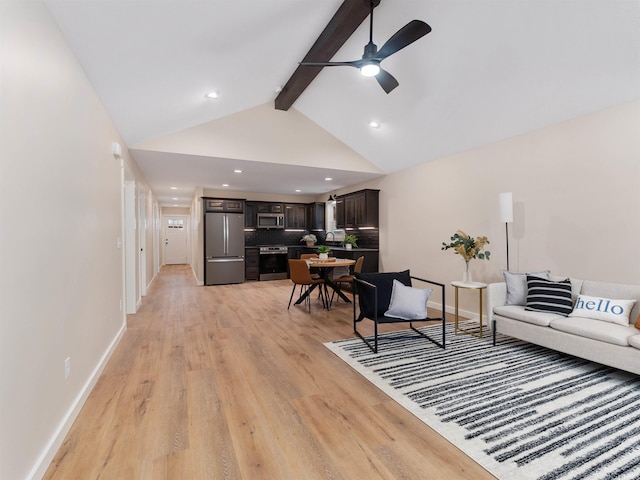 living room featuring beam ceiling, light wood-style floors, baseboards, and ceiling fan