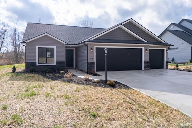 view of front of house featuring a garage, brick siding, driveway, and a shingled roof