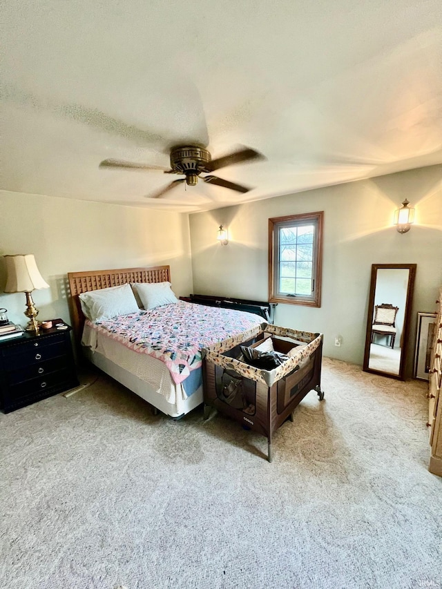 carpeted bedroom featuring a ceiling fan