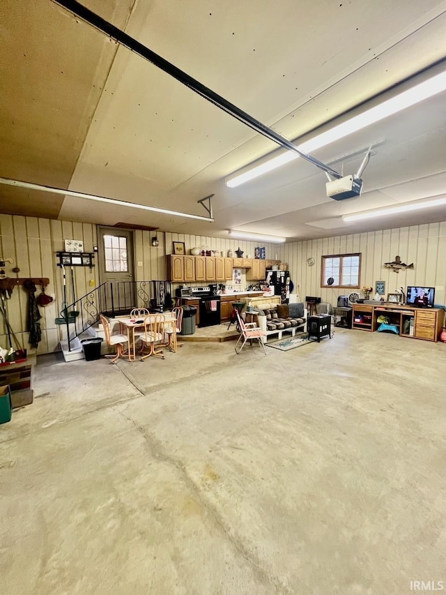 garage featuring a workshop area and a garage door opener