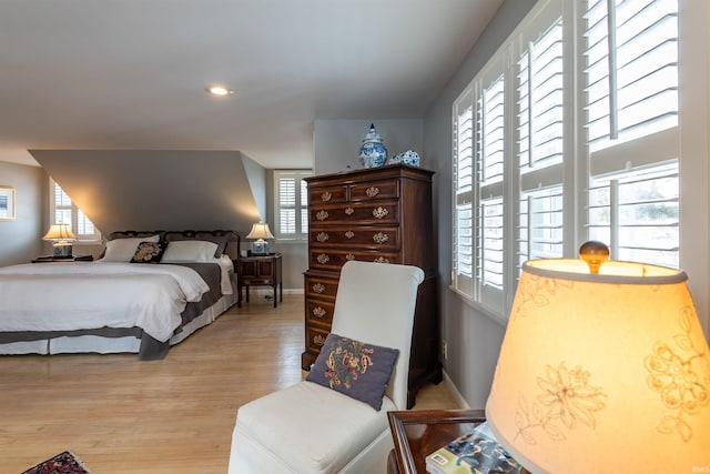 bedroom featuring recessed lighting, light wood-style flooring, and baseboards