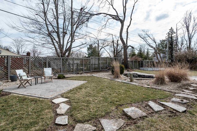 view of yard with a patio and a fenced backyard