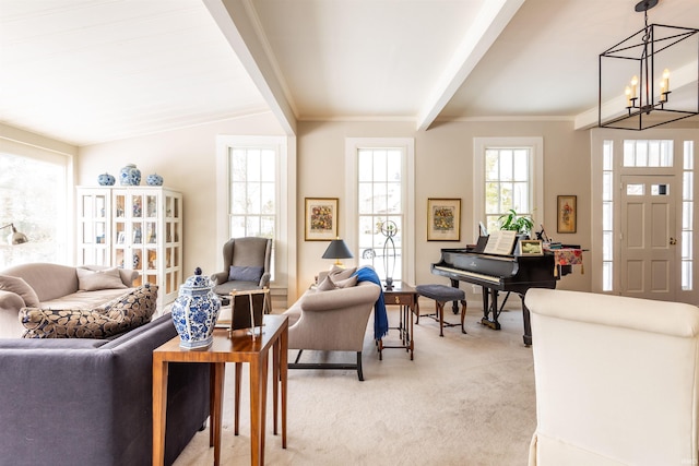 sitting room with light carpet, beamed ceiling, crown molding, and a notable chandelier