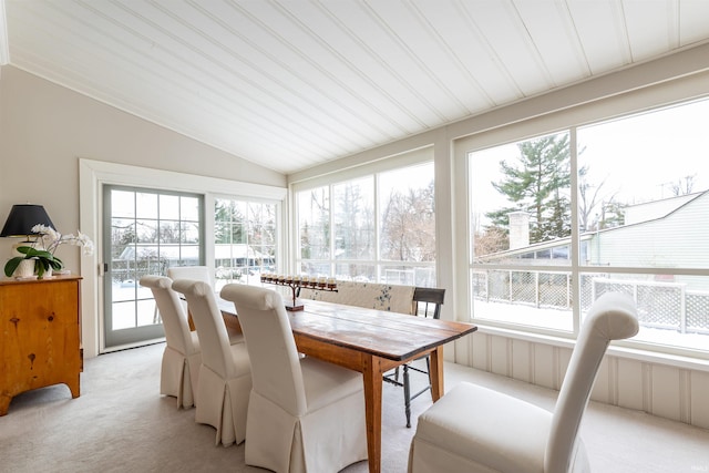 sunroom featuring vaulted ceiling