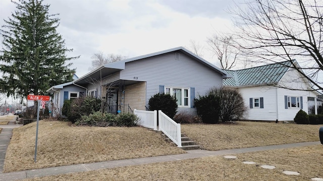 view of front facade with a standing seam roof and metal roof