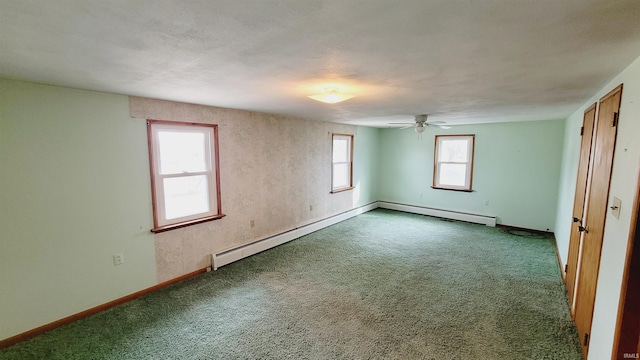 unfurnished room with baseboard heating, ceiling fan, baseboards, and carpet floors