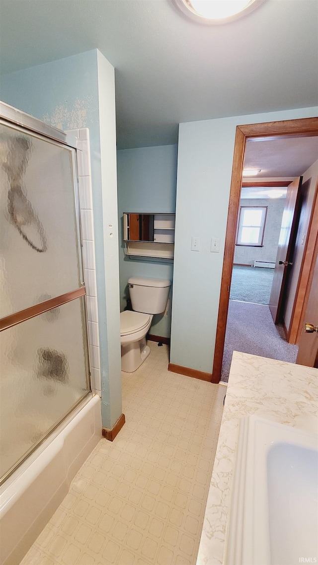 bathroom with baseboards, bath / shower combo with glass door, tile patterned floors, toilet, and baseboard heating