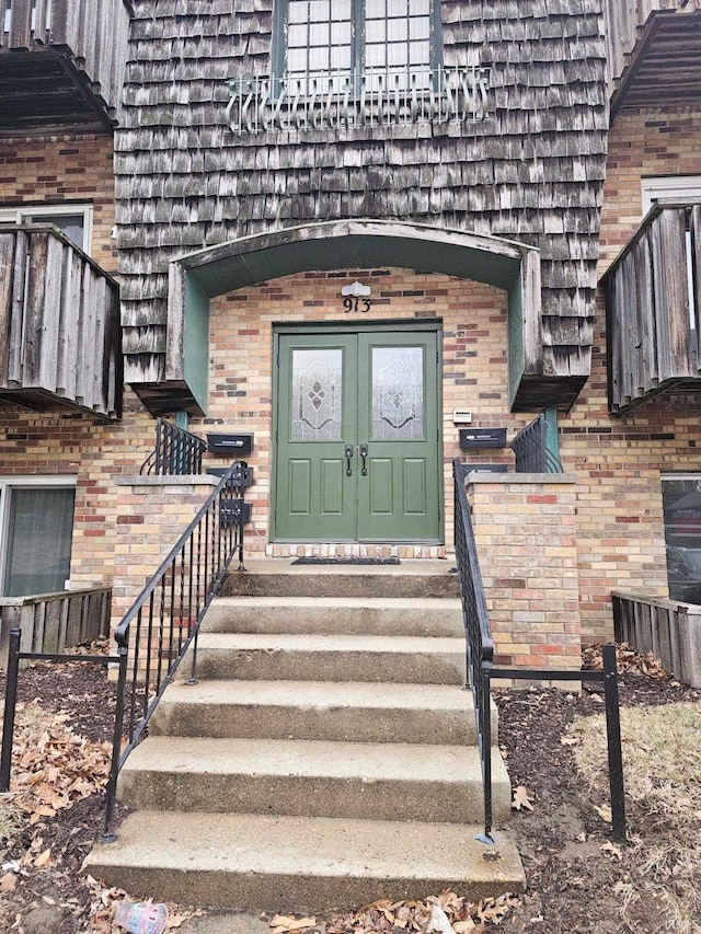 entrance to property with brick siding